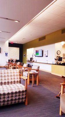 Lobby has  comfy variety of seating even rocking chairs.