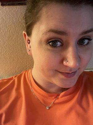 Conch piercing and nose piercing