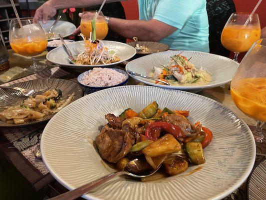 Pad Thai, green curry with chicken, and sweet and sour pork with Thai iced tea