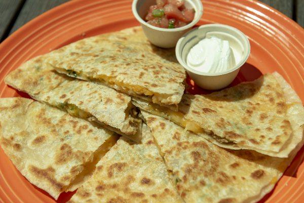 Quesadillas grilled on the plancha served with tangy pico de gallo and sour cream.