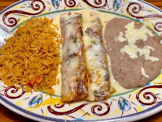 Cheese enchiladas with queso blanco sauce. Tasted great with their salsa.