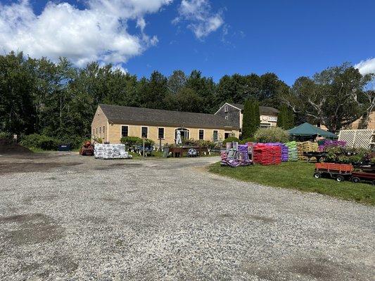 It's a farm store!  Complete with palates of dirt and sod and plants out front.