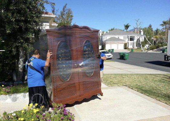 Alfred and Hector moving an 850lb wine cabinet with ease. Arrived in perfect condition.