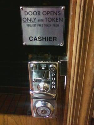 Bathroom door signage...get your damn token!!