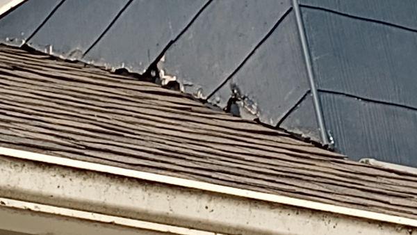 This is the damage to my siding. The "fix" is a four inch piece of black tin.