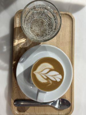 Espresso macchiato with homemade almond milk and bubble water