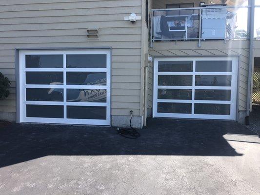 Modern Classic garage doors. Aluminum frame and Satin Etch glass.