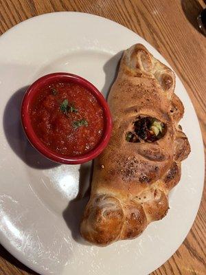 Artichoke, sundried tomato, and jalapeño calzone