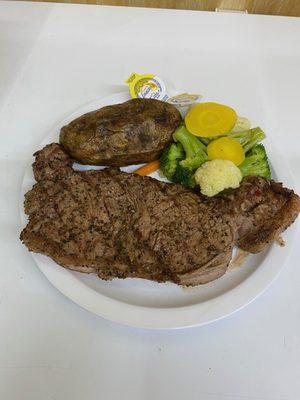 Actual 12 oz New York Strip grilled to order with baked potato and veggies - just $18.99