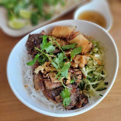 Vermicilli bowl with grilled pork and eggroll. Excellent