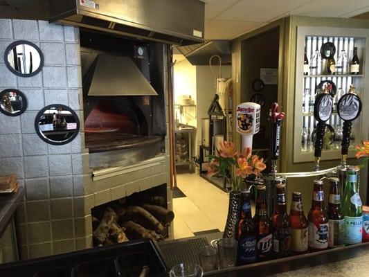 Wood fired pizzas, home brews, happy hour everyday 3-6 and all day on Sunday! Just the smells are delicious!