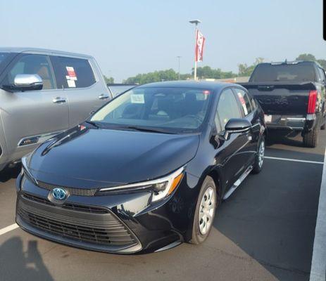 My new Corolla Hybrid LE just before driving off the lot!