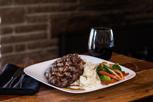 Grilled Rib Eye Steak served with garlic mashed Yukon gold potatoes, and fresh seasonal vegetables