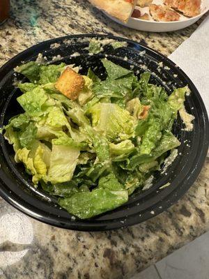 Caesar salad with dressing on