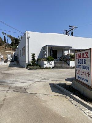 The business signage and the body shop entrance - go to back building of 508 Monterey Pass Road MP