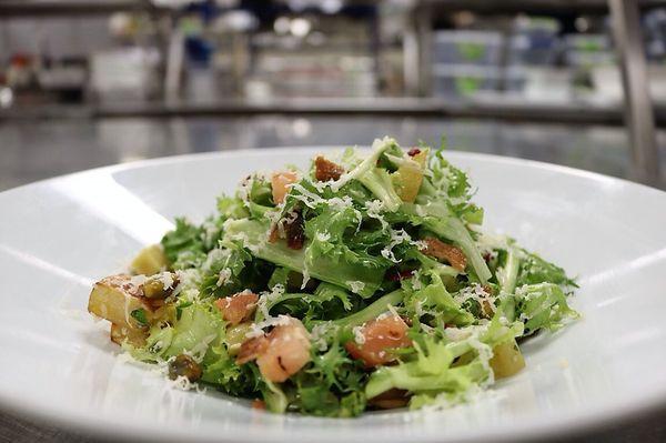 Frisée salad with lardons and roasted Jerusalem sun chokes