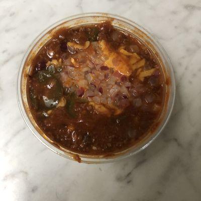 Chumps Chili with onions and cheddar cheese. Chili came in a nice sized container (this the smaller size not the bowl size).