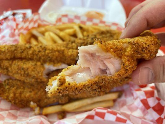 3 Catfish strips with fries.