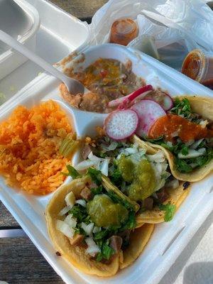 Tacos de lengua with a side of rice and beans