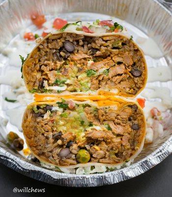 A cross-sectional shot of the Al Pastor Burrito