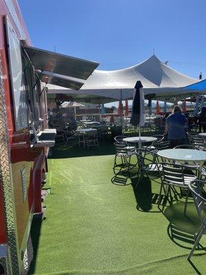 Bar area in front of food truck facing the stage