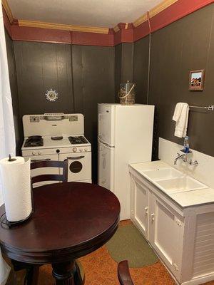 Kitchenette. Not sure if the stove is actually functioning or just for decorative use.