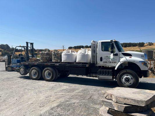 Our flatbed delivery truck on its way out to make another run.