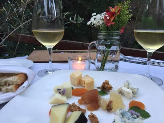 Cheese plate with some moscato.