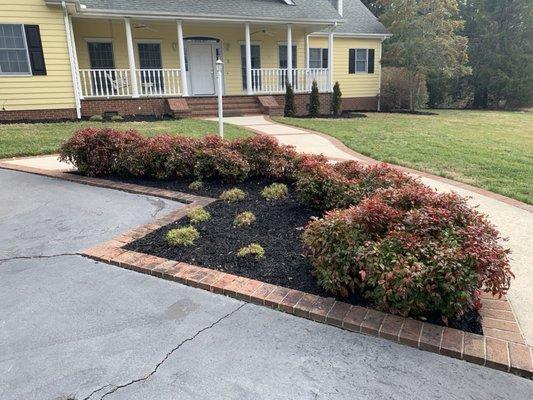 Mulching and pressure washing sidewalk.