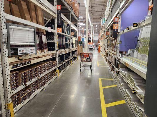 The aisle where window blinds and shutters are, a staff member can cut cut them for you right then and there