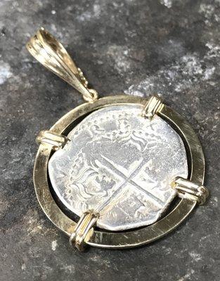 Hand fabricated pendant to hold clients coin.