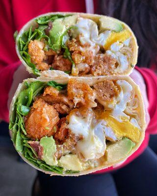 BEYOND BREAKFAST BURRITO - beyond sausage of choice, spicy basil aioli, arugula, tater tots, avocado, tomato, cheese and 3 fried eggs