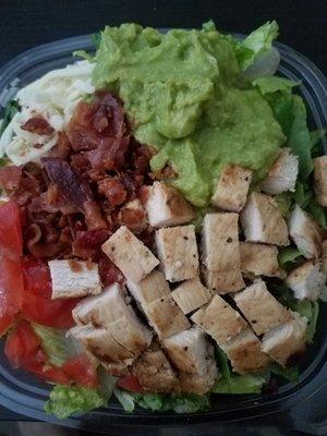 Southwest salad before the dressing. Chicken, avocado, tomatoes, cheese, and bacon.