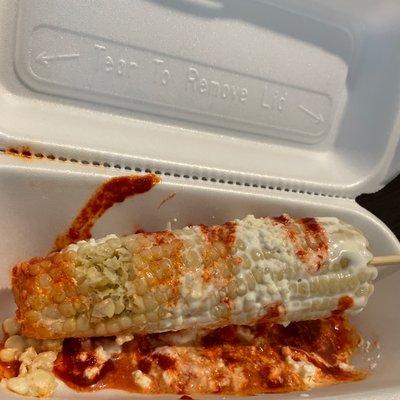 Elote Entero with mayo, Parmesan cheese, cotija, powder chili and what I'm pretty sure is chamoy.