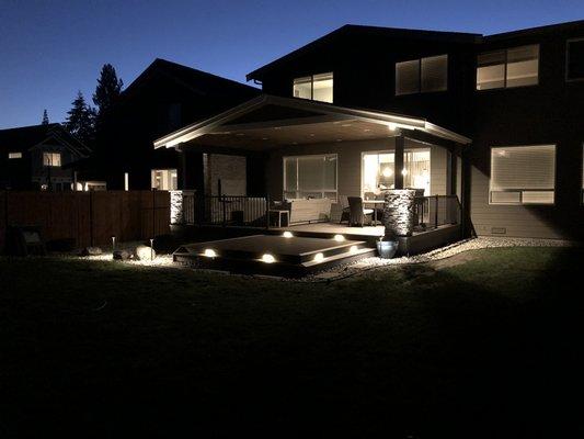 Covered deck (with landscape lighting by Sound Irrigation) completed by Art/Tek