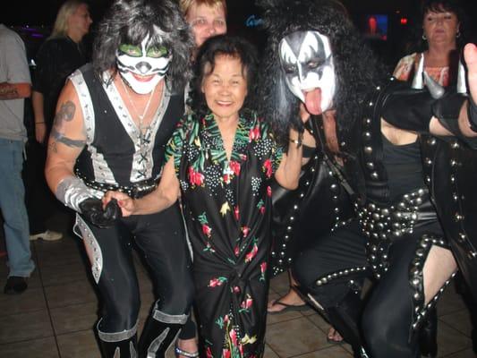 Kiss tribute band members who visited Genes one night- they are posing with "momma" a Genes regular!