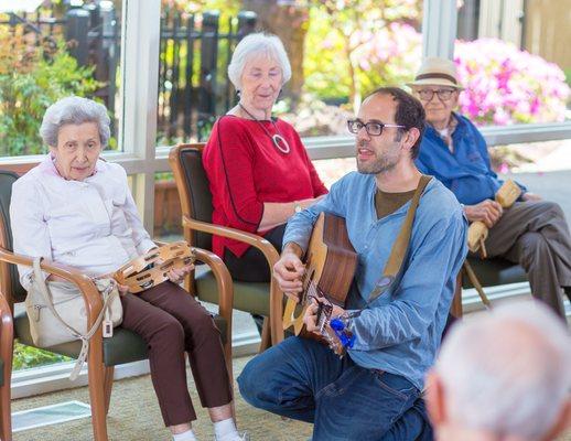 Residents and family members make some noise at Drumming Circle!