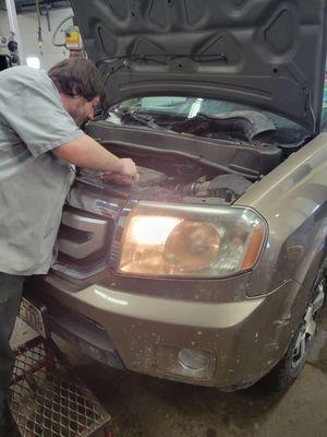 Nate our tech working on a Honda Pilot