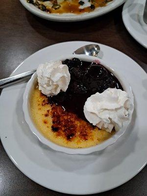 Creme Brulee with mixed berries and whipped topping