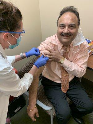 Dr. Dhaliwal getting COVID Vaccine in January 2021 at Trinity Hospital.