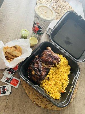 Half chicken with mango juice, fries, and rice