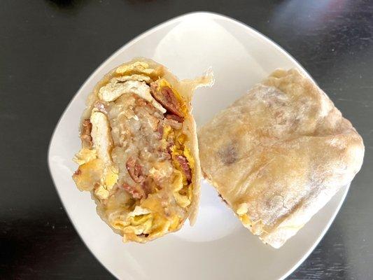 Bacon Breakfast Burrito. Hashbrowns, scrambled eggs, chunks of bacon pieces, and melted cheese. Recommend ordering this.