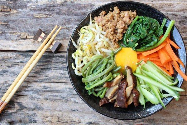 Traditional Korean dish - Bibimbap assorted vegetables, meat, & rice in a hot stone bowl! #SeoulGalbi #KoreanBBQ #AllMeats #HighQuality #T