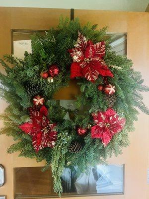 This wreath is huge! This is a big door and it fills the whole thing. Only $55!