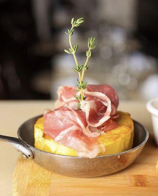 Potatoes Tart and Jamon Serrano from our Tapas Menu Section .