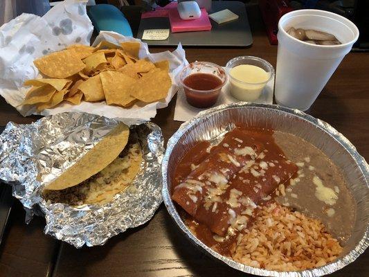 2 enchiladas, taco, rice and beans. Cheese dip that came with chips and salsa.