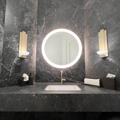 Floating powder room vanity with lighted mirror