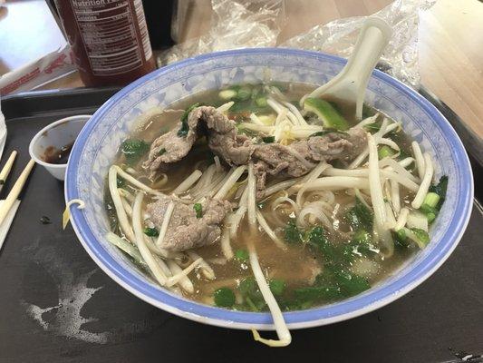 Delicious pho with plenty of beef. They include a bag with bean sprouts, Lime wedge and fresh basil.