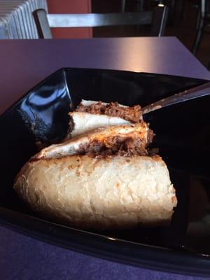 Mini-cheesesteak with sauce and onion. Didn't disappoint!