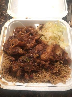 This place is AMAZING I had the oxtails rice and peas cabbage Hubby had the curry chicken food was so delicious no one spoke while eating